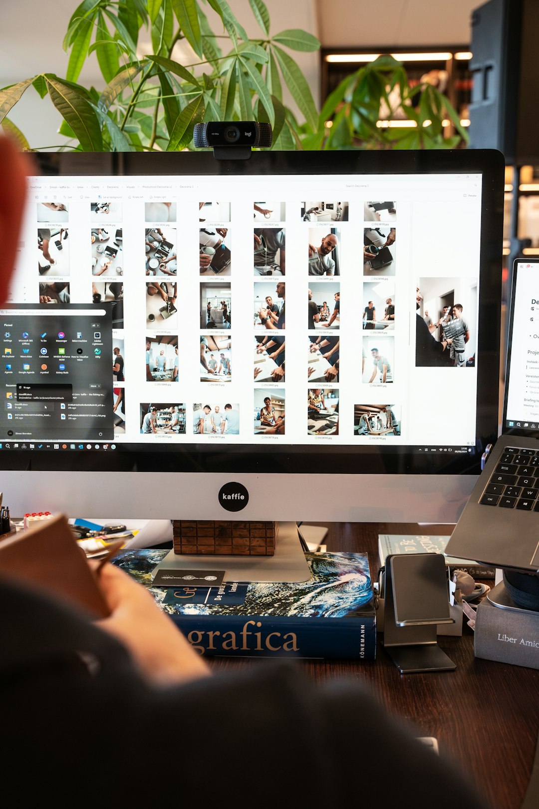 a-man-sitting-in-front-of-a-computer-on-a-desk-lxsrlfsa-8m