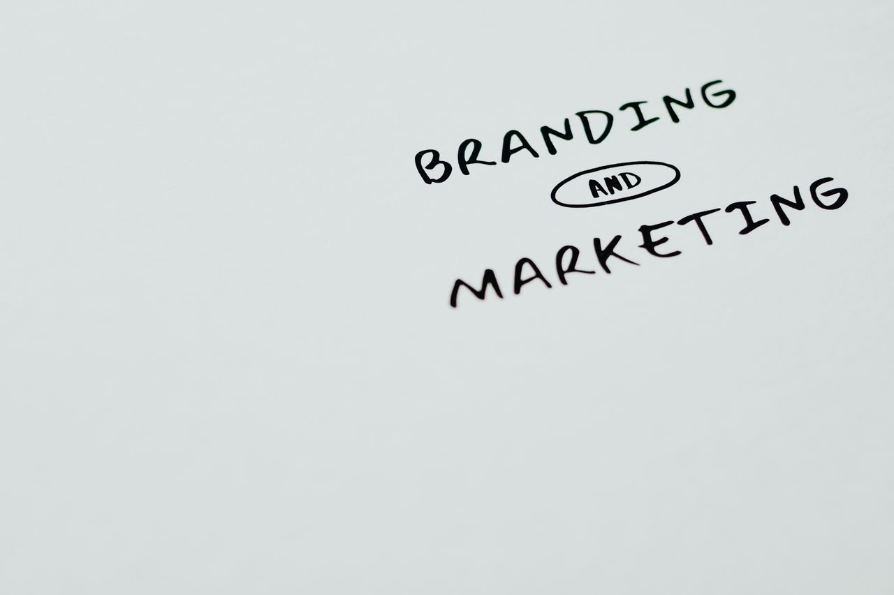 A minimalist image featuring the words Branding and Marketing on a white background, ideal for digital marketing themes.